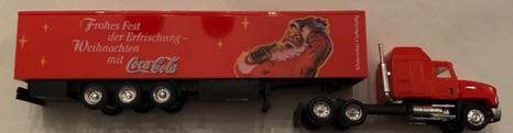 10145-2 € 10,00 coca cola vrachtwagen kerstman met flesje 20 cm.jpeg